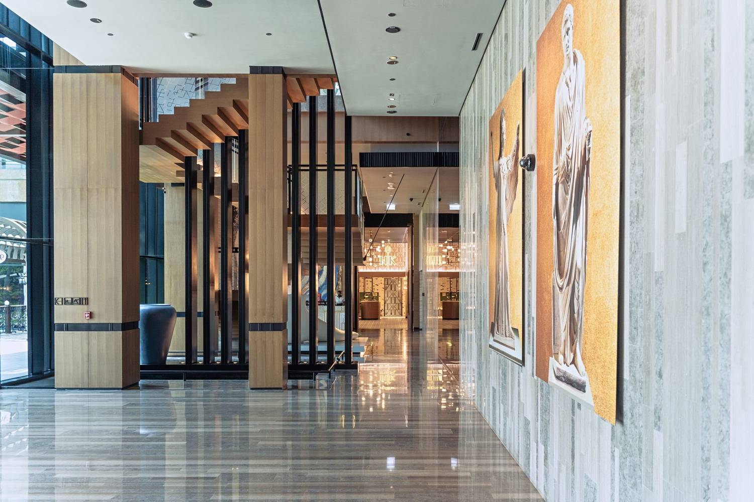 Spacious and modern hotel lobby in Dubai with elegant decor and marble floors.