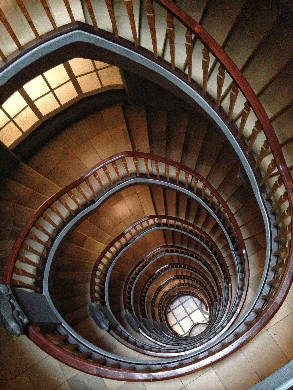 A mesmerizing view of a spiral staircase in Hamburg, showing intricate design and perspective.