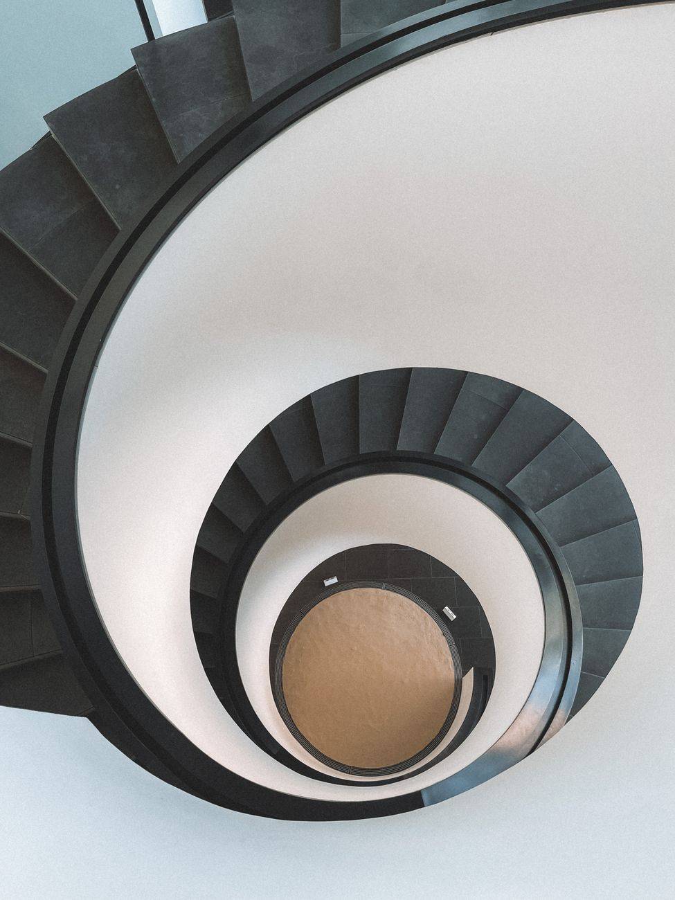 Elegant spiral staircase captured from above in a modern building, Nuremberg.
