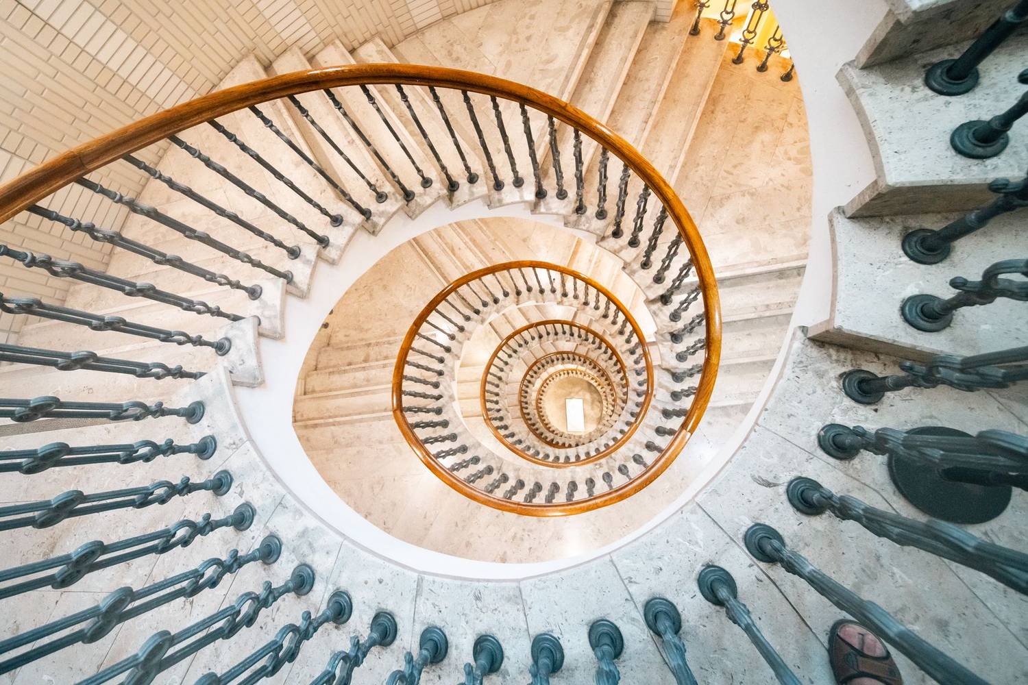 Elevated view of a stunning spiral staircase with elegant handrails.
