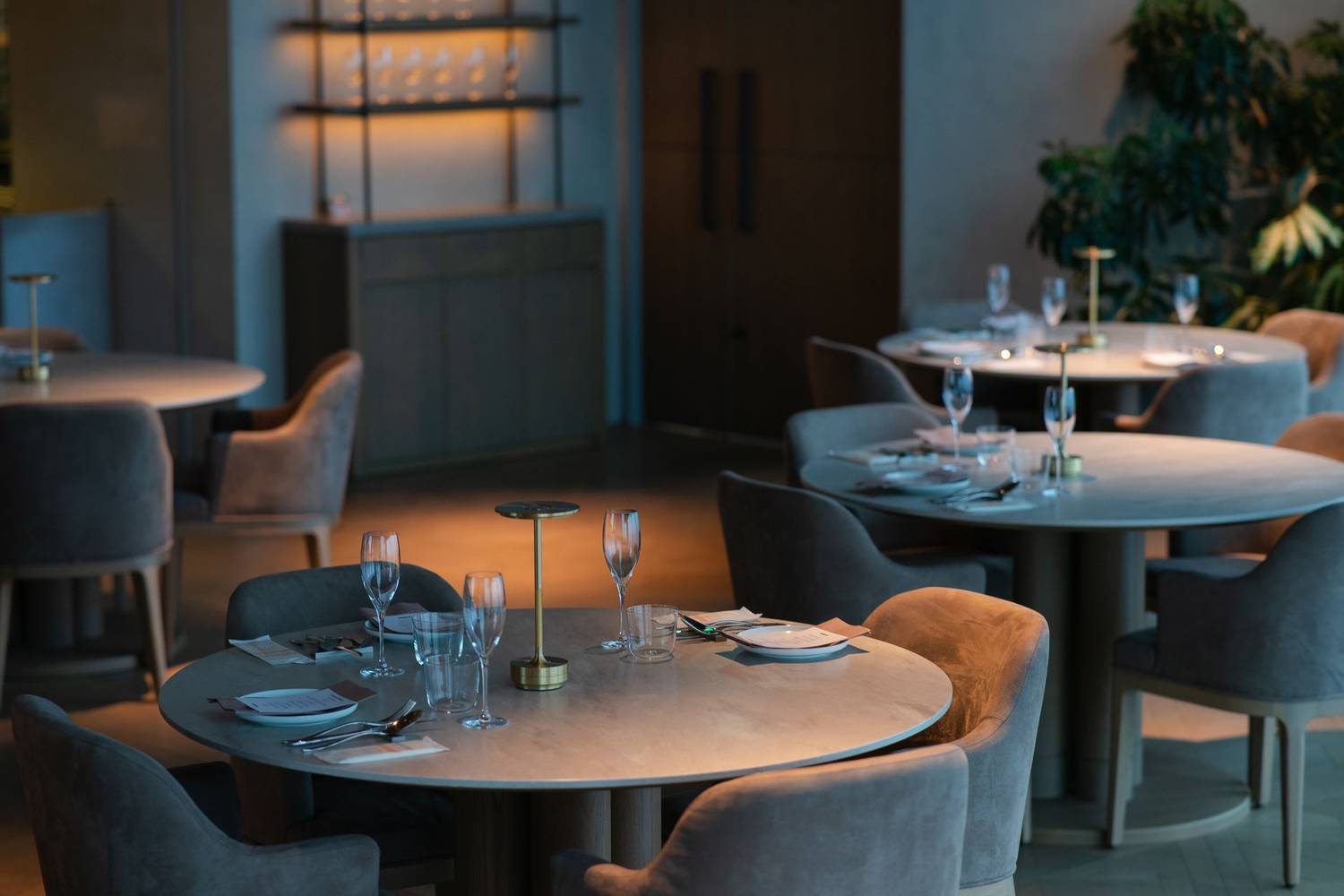 A sophisticated dining area with minimalist decor in a Tokyo restaurant.