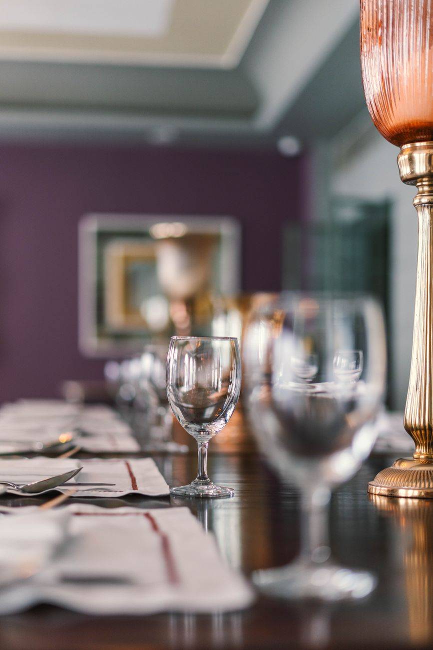 Luxurious dining table setup with crystal glassware and elegant decor in Bikaner, India.