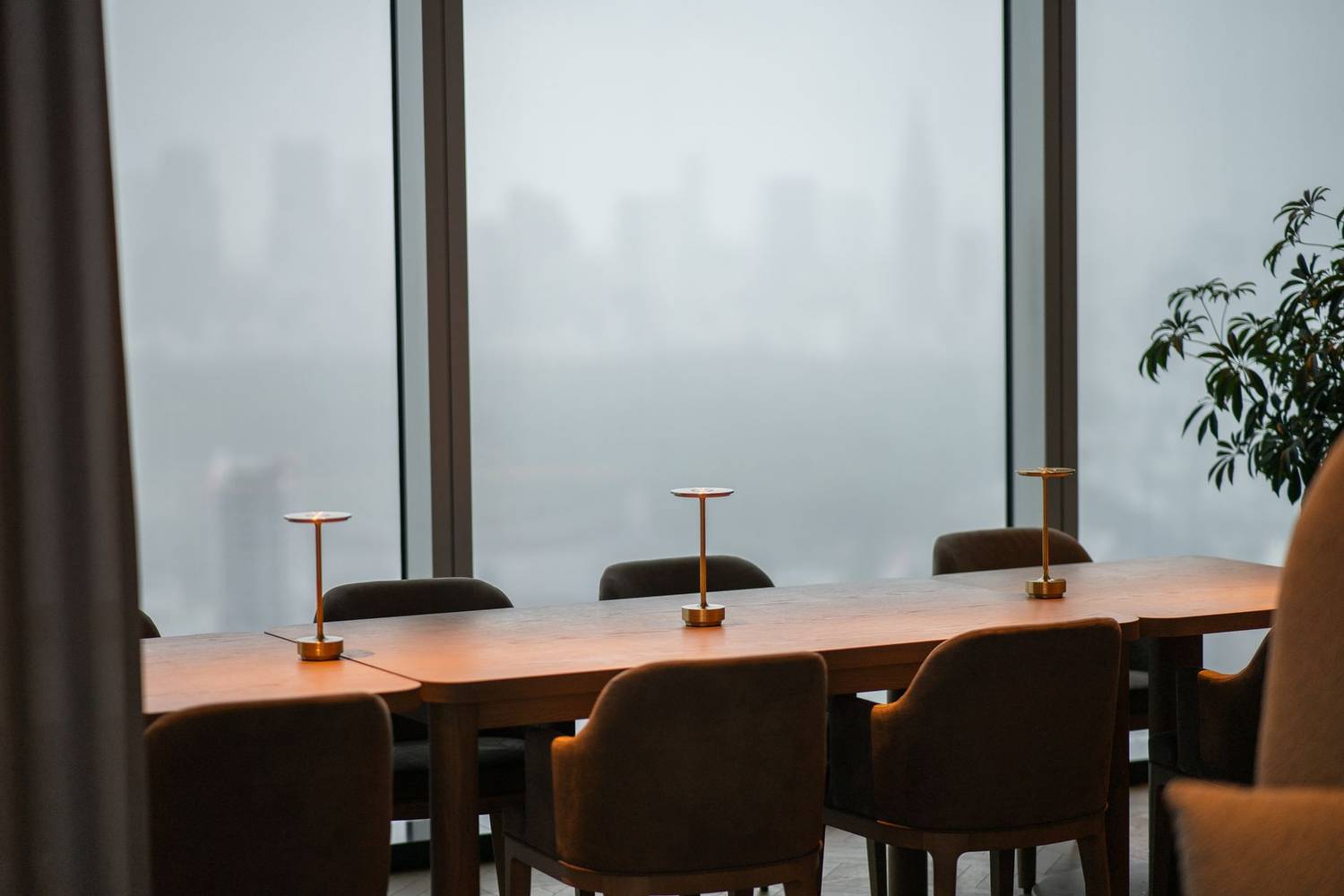 Sophisticated dining area with panoramic views of the Tokyo skyline through large windows.