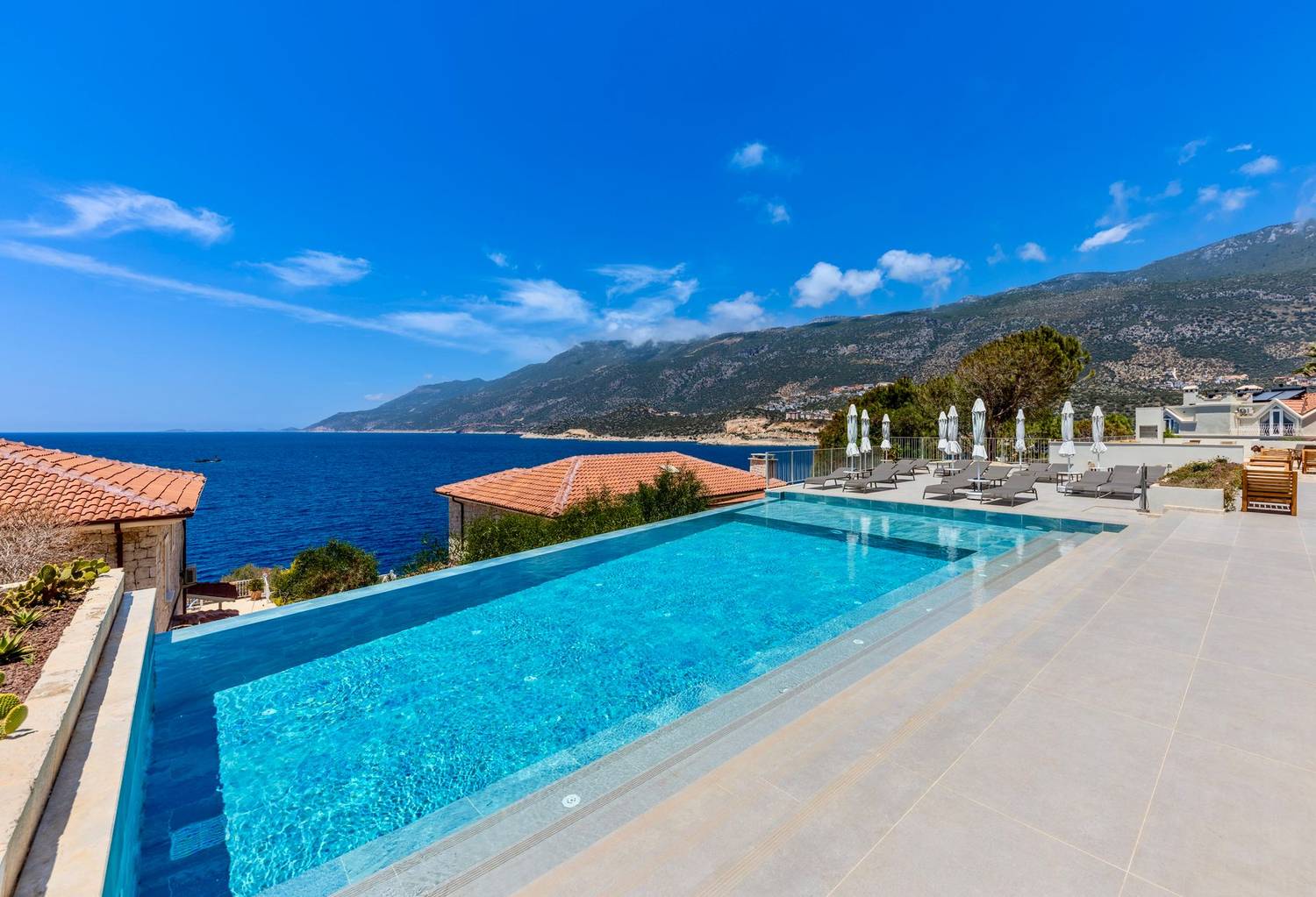 Stunning infinity pool overlooking the Mediterranean Sea, perfect for a luxury vacation escape.