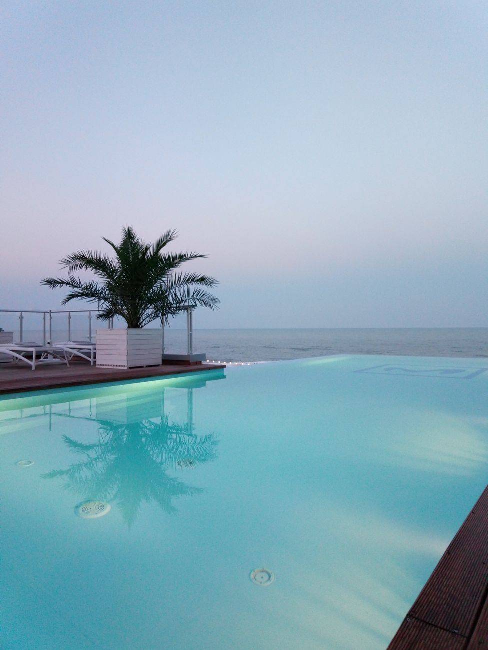 Infinity pool overlooking the serene ocean at a resort in Zatoka, Ukraine.