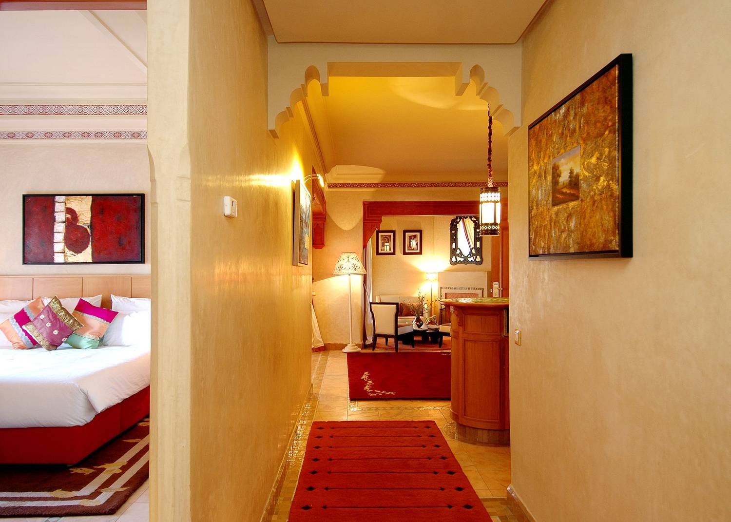 Stunning interior of a luxurious hotel room with elegant decor, vibrant colors, and warm lighting, evoking elegance.