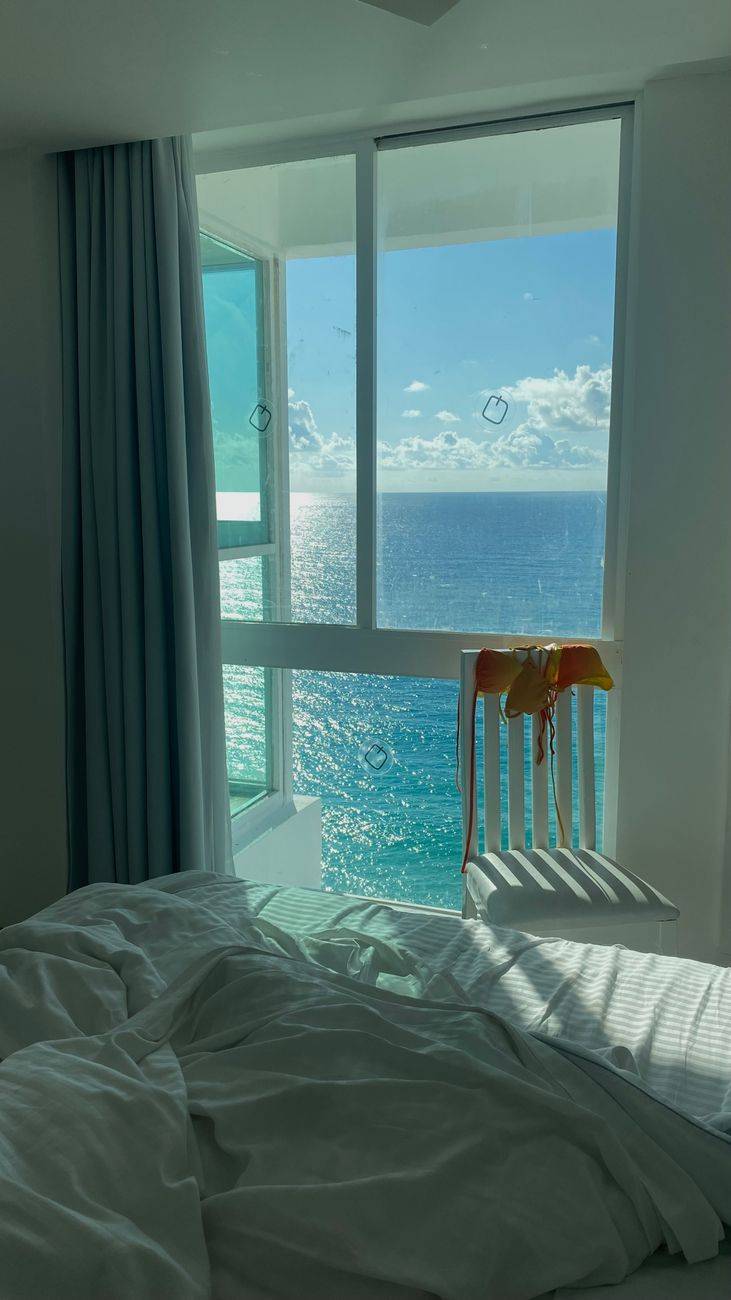 Relax by the ocean with a stunning view from a cozy beachfront room in Cancun.